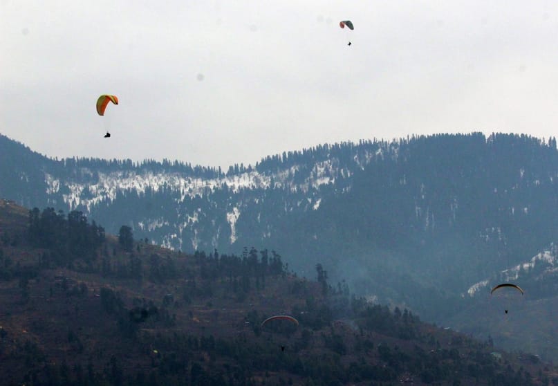 Tourists are having fun in the snow and flying in the air