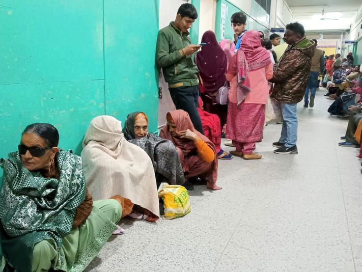 Waiting for turn on cold floor for treatment outside OPD