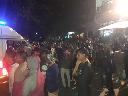 A truck full of wood overturned in the market and a young man was buried under it