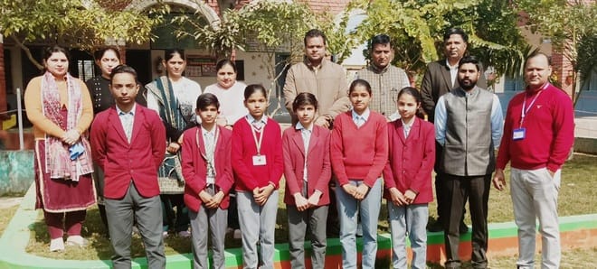 Lakshmi got first place in the district in NMMS examination
