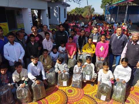 Chhat Cooperative Society distributed shoes, socks and bags to school children