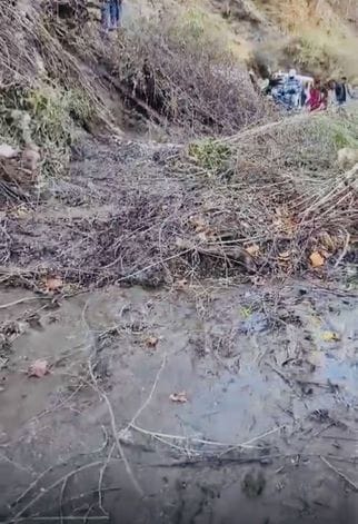 Landslide caused by breach of canal, wheels of vehicles stuck on Nithar-Luhri road