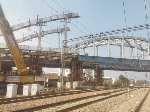 Steel truss work on one side of overbridge completed, work on the other side started
