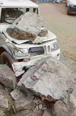 Four vehicles damaged due to falling of rocks from the hill