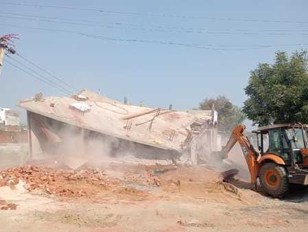 Bulldozer runs on 5 illegally built DPCs and 3 showrooms