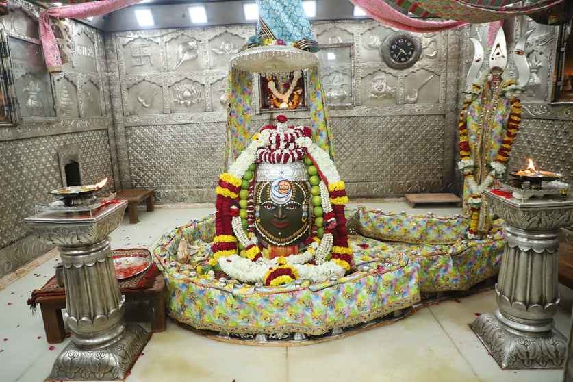 Baba Mahakal adorned with new clothes, dupatta, crown, head garland and umbrella was adorned