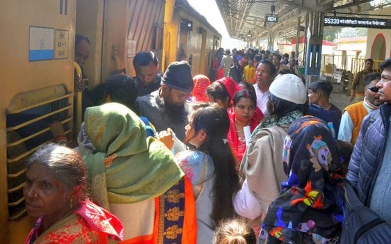 Passengers are able to board packed trains only after jostling