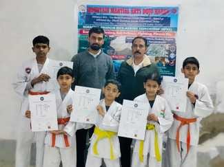 Three students achieved orange and two students achieved yellow belt