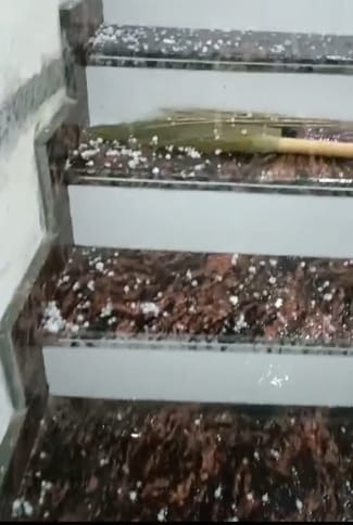 Hailstones fell along with rain