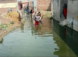 Waterlogging in front of houses, making it difficult to even get out
