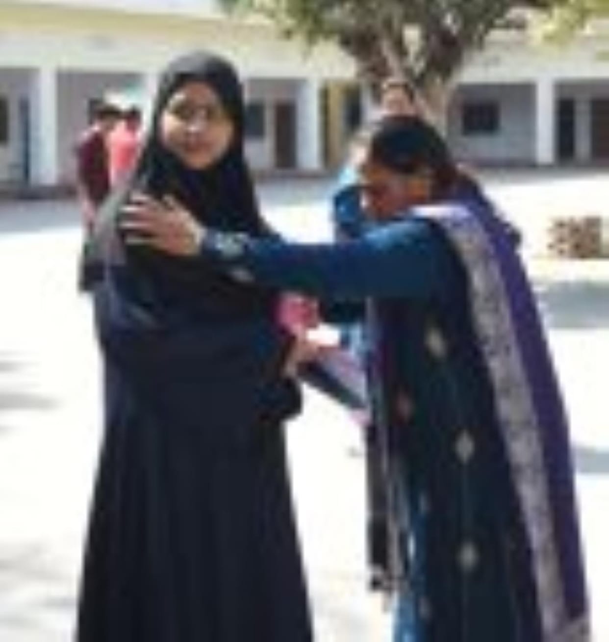 Girl students wearing burqa were stopped, they were allowed entry after taking them off.