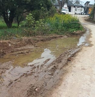 Pedestrians face trouble due to waterlogging on the roadside