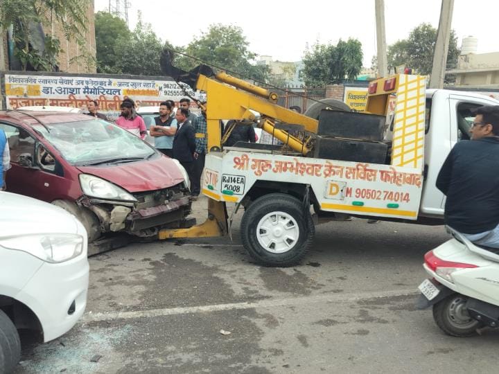 Car overturns after hitting divider, driver saved