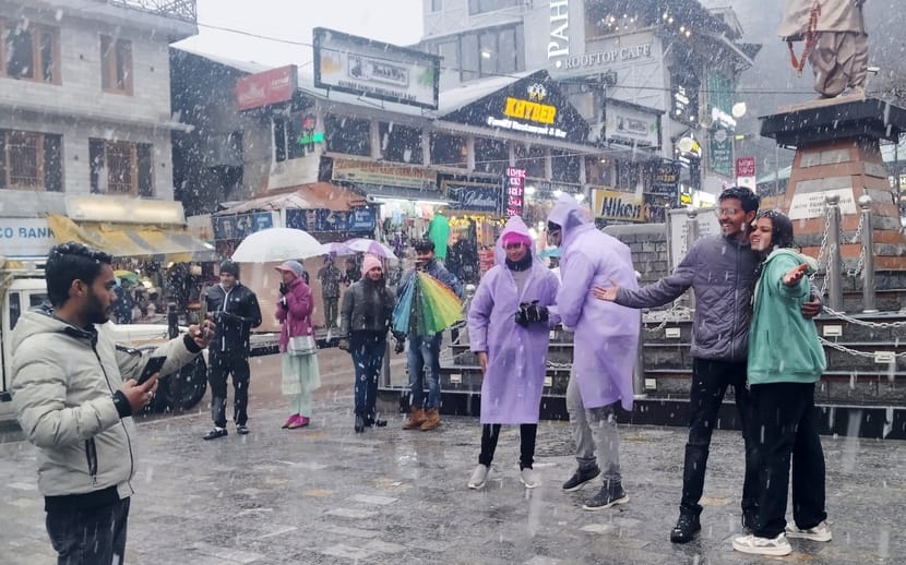 Tourists were thrilled to see snow in Manali's Mall Road.