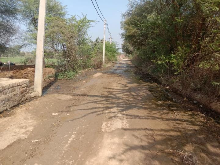 Water was sprinkled on the road to suppress dust clouds