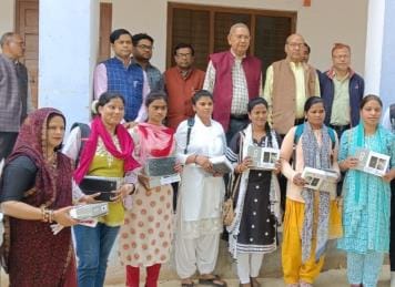 The faces of the girl students lit up after receiving the tablets.