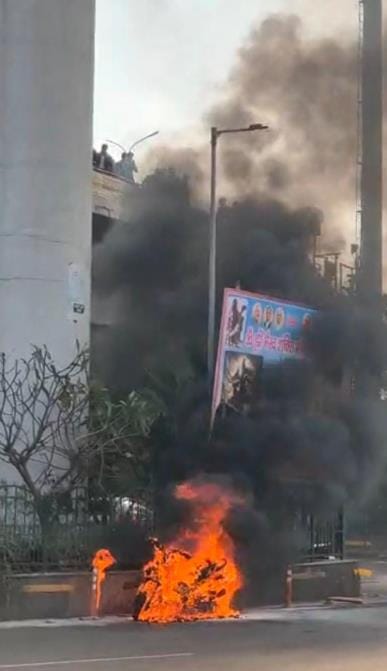 Moving scooter caught fire, woman saved her life by jumping
