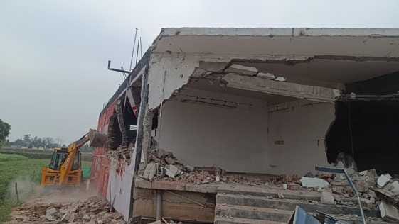 Bulldozer hit 2 shops and 1 hotel