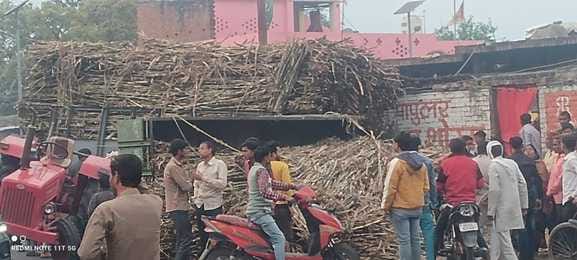 Double trolleys loaded with sugarcane overturned, house damaged