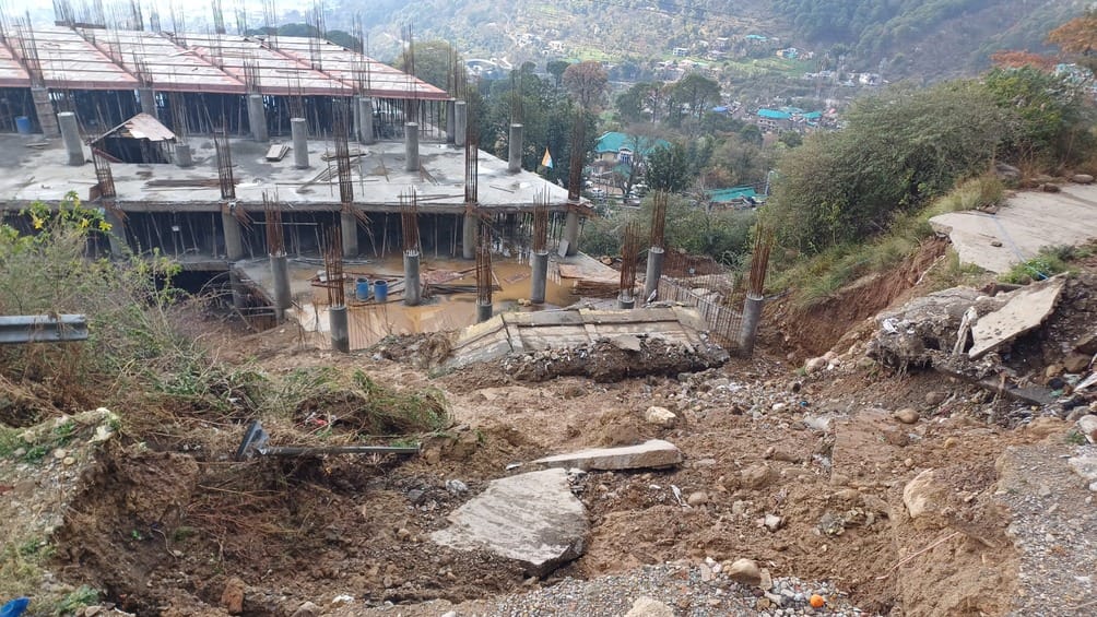 Hill collapses again near under construction parking, increased danger