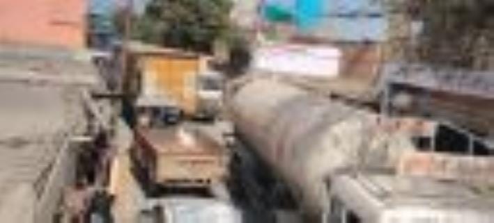 Heavy vehicles stopped on the bridge, long jam in Shamshabad