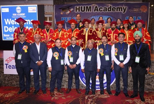 Special guests of Rotary Club honored with Himachali cap