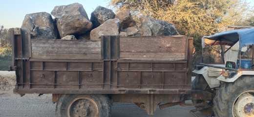 Tractor-trolley and truck caught carrying stones and gravel, seized