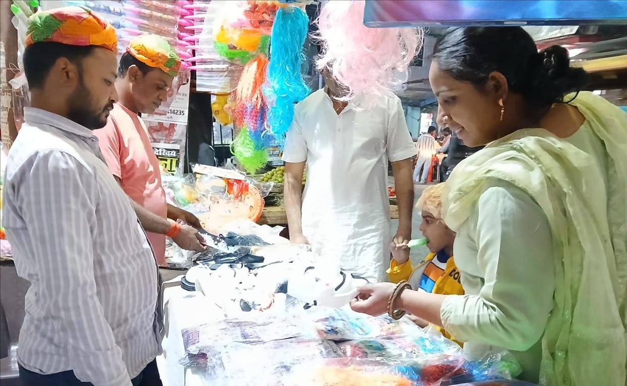 Holi's joy started spreading, shops of color and water guns were decorated