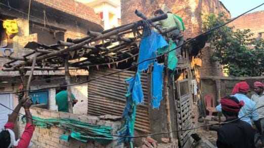 Employees removing encroachment.