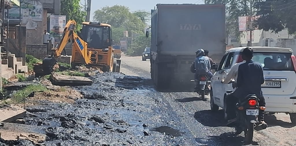 Travelling on the dilapidated Delhi road has become difficult