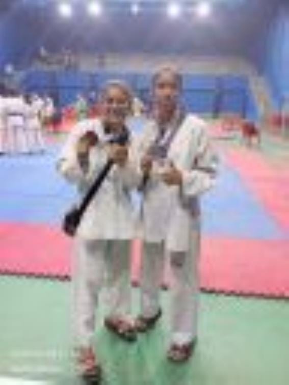 Daughters increased the pride of the district by winning medals in Taekwondo
