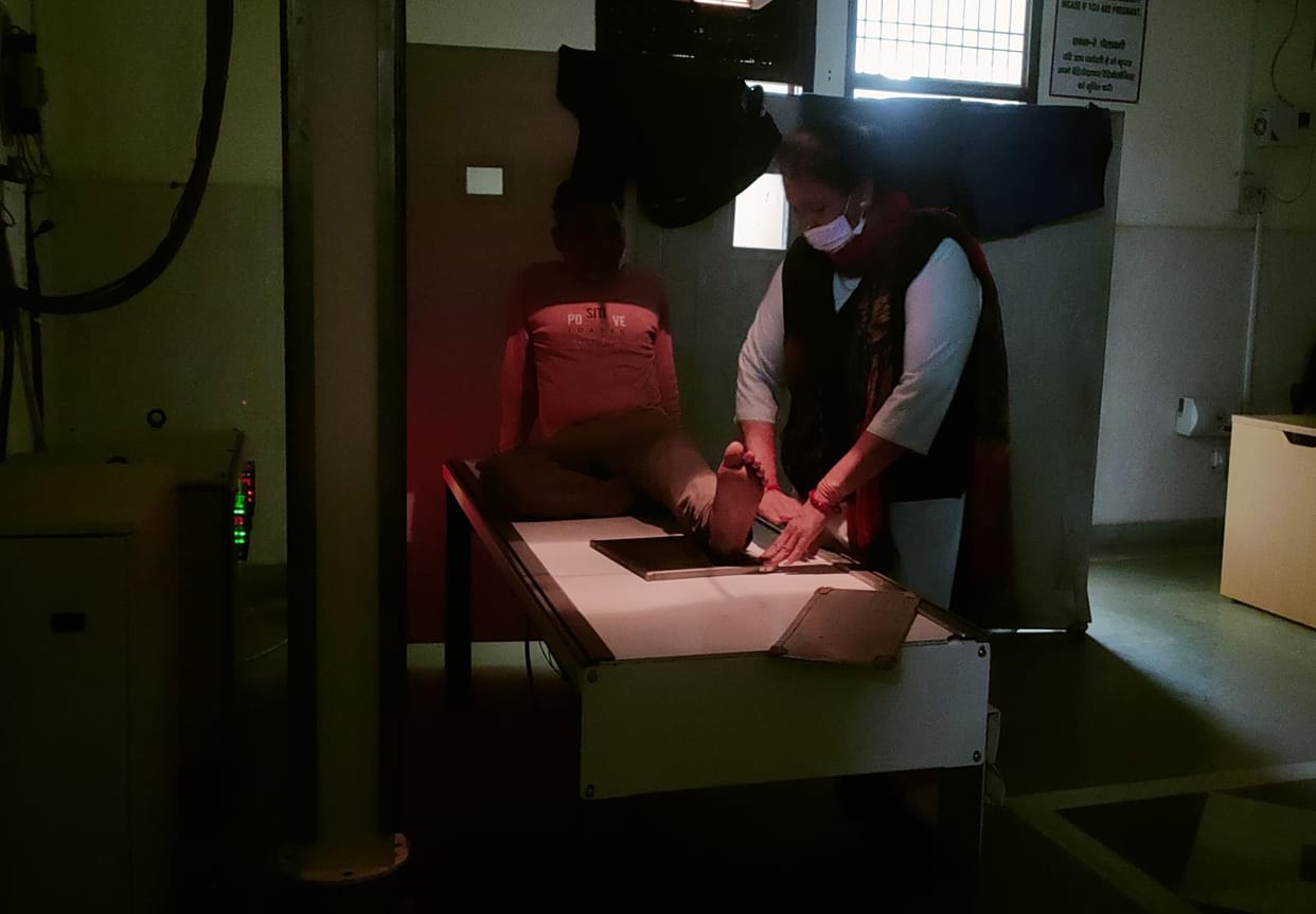 Female ward servant doing X-rays of patients