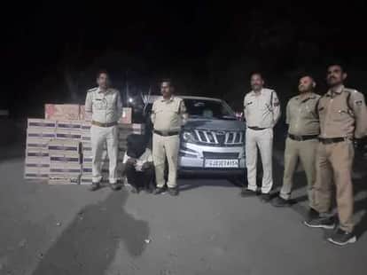 65 crates of English liquor and 5 crates of beer seized from a luxury car