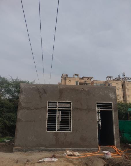 Staff room built under high voltage wire in dog pond