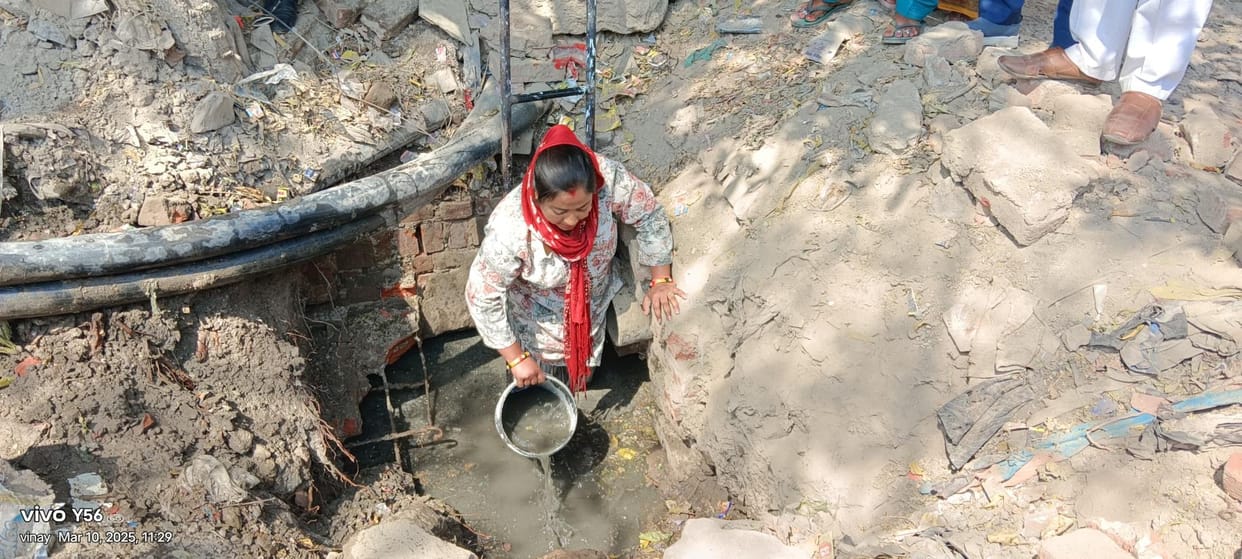 The councillor protested by getting down into the sewer line pit