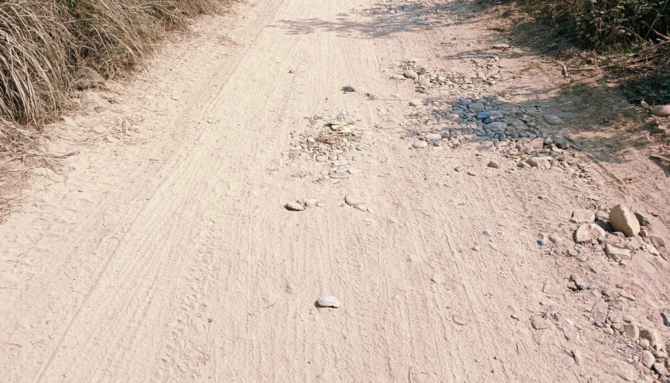 The asphalt road started to crumble as soon as it was built... Villagers stopped the construction work
