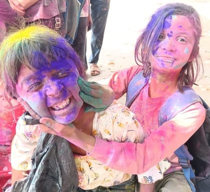 The market is painted in the colors of Holi, happiness is expressed with abir-gulal