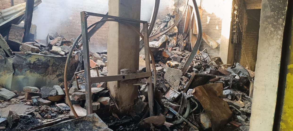 Iron girders melted in the fire in the market