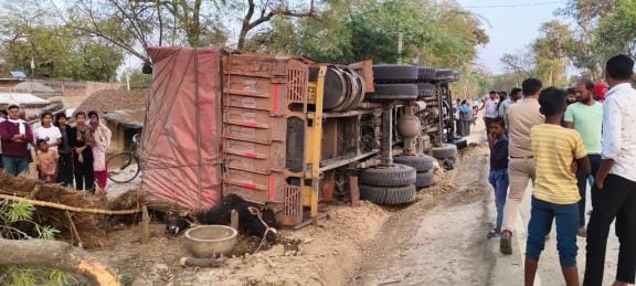 A young man died and his friend was injured as a truck overturned
