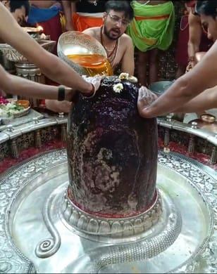 Baba Mahakal celebrated festival of colours by offering pot of water mixed with saffron on Rang Panchami