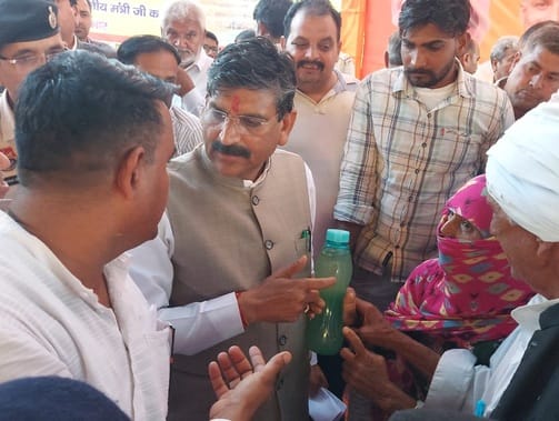A woman arrived at the cabinet minister's thanksgiving ceremony with a bottle of dirty water, said even the drinking water is not potable