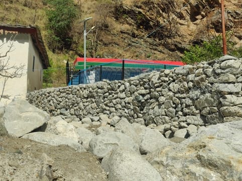 Villagers upset with the negligence started building the security wall themselves