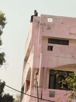 A woman climbed to the third floor of the tehsil, causing a stir