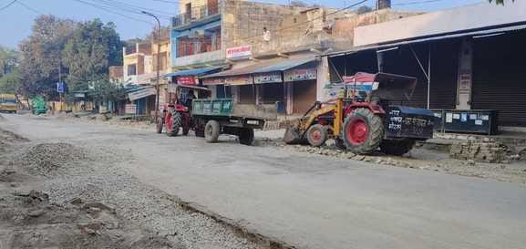 Remove gravel and stones lying on Tehsil Road