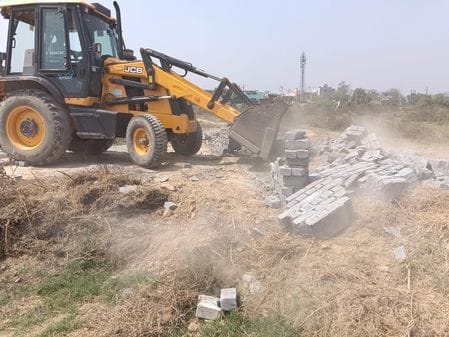 Bulldozer run on illegal colony being built on five acres