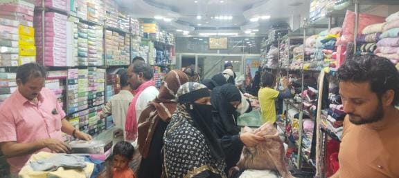 People are shopping for Eid by going to the market instead of online