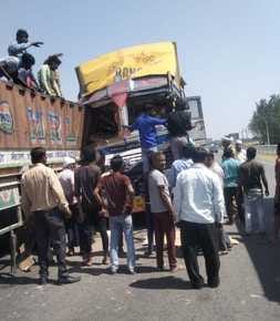 Container collided with parked trailer, driver was stuck in cabin for half an hour