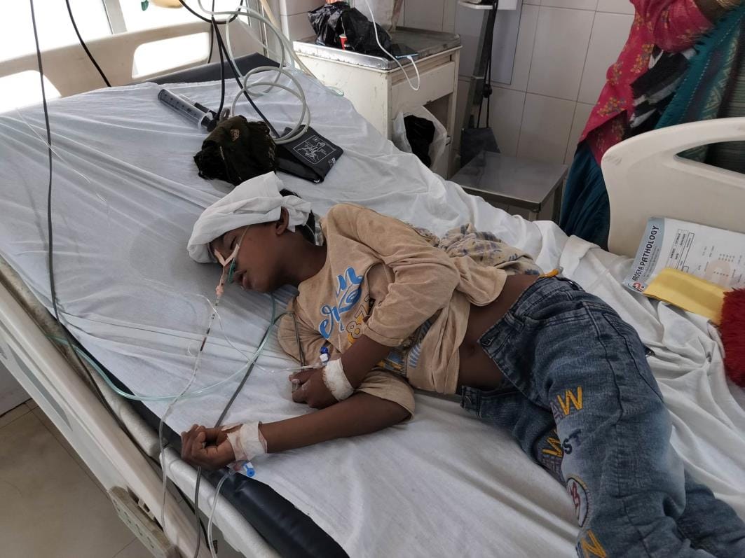 A child found suffering from pneumonia and suspected fever