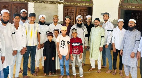 Protested by wearing black bands, farewell prayers were offered under police surveillance