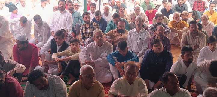 Devotees reached the mosque wearing black bands for the farewell Friday prayers